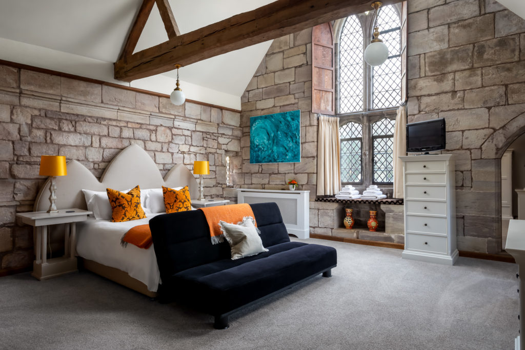 corporate bedroom with historical features from an old chapel