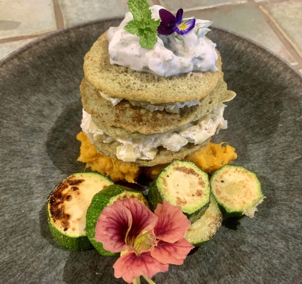 a pancake stack with courgette and creme inside 